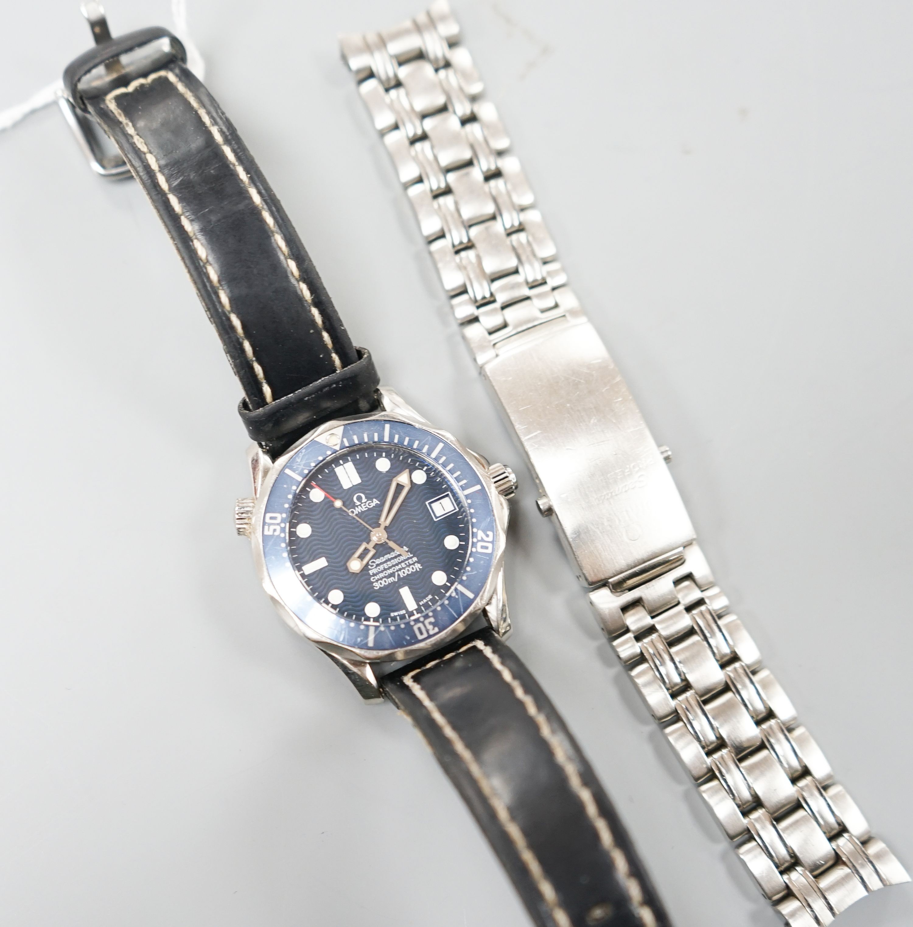 A gentleman's 2006 stainless steel Omega Seamaster Professional chronometer wrist watch, movement c.1120, on associated leather strap, but comes with original Omega steel bracelet, no box or papers